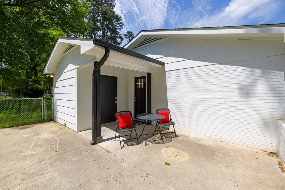 Aluminum downspout running down the corner of a two-story home