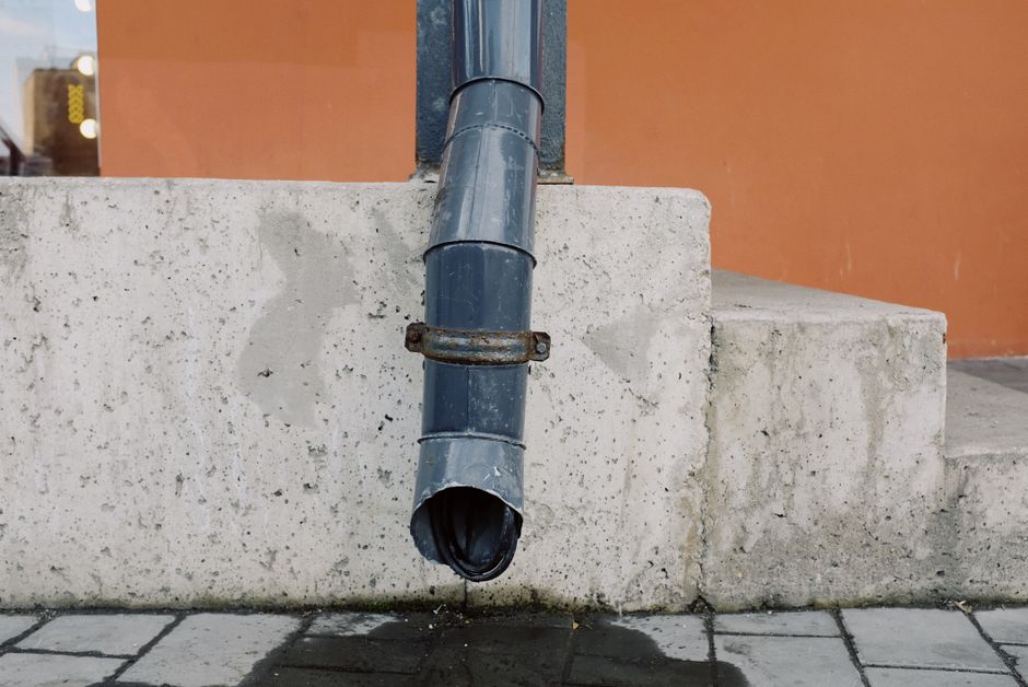 Downspout with an extension directing water away from a home's foundation